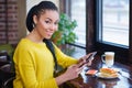 Beautiful mixed race teenage girl using digital tablet Royalty Free Stock Photo