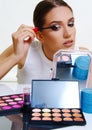 Beautiful model applying make up Royalty Free Stock Photo