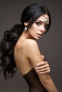 Beautiful model brunette with long curled hair Royalty Free Stock Photo