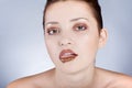 Beautiful model eating chocolate, in the studio Royalty Free Stock Photo