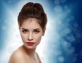 Beautiful model with elegant hairstyle. Christmas background. Wi