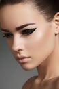 Beautiful model face with fashion eyeliner make-up