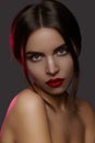 Beautiful model with fashion make-up. Close-up portrait woman with glamour lip gloss makeup and bright eye shadows. Royalty Free Stock Photo