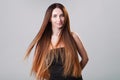 Beautiful model girl with shiny flying brown ombre straight long hair . Care and hair products . Royalty Free Stock Photo