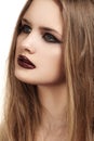 Beautiful model with long hair & grunge dark gloss lips make-up, black liner Royalty Free Stock Photo