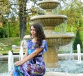 Beautiful model posing next to fountain