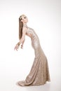 Beautiful model posing in a sparkling dress Royalty Free Stock Photo