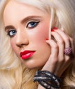 Beautiful model with red lips and manicure