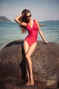 Beautiful model in red swimsuit.