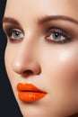 Beautiful model with fashion lipgloss make-up Royalty Free Stock Photo