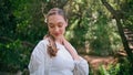 Beautiful model walking forest smiling gently closeup. Cute woman strolling park Royalty Free Stock Photo