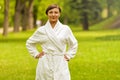 A beautiful model wearing a white toweling robe standing Royalty Free Stock Photo