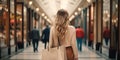 A beautiful model woman walking with shopping bags buying clothes in stores on a paris street in france. fashionable lady with