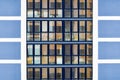 Beautiful modern blue glass fiberglass windows of the facade wall of a modern skyscraper building house. Background, texture Royalty Free Stock Photo