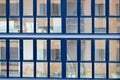 Beautiful modern blue glass fiberglass windows of the facade wall of a modern skyscraper building house. Background, texture Royalty Free Stock Photo