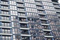 Beautiful modern blue glass fiberglass windows of the facade wall of a modern skyscraper building house. Background, texture Royalty Free Stock Photo