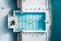 A beautiful, modern city or hotel swimming pool, view from the drone, the perfect place to relax or vacation.