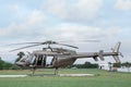 Beautiful modern helicopter on helipad in field Royalty Free Stock Photo