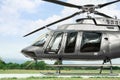 Beautiful modern helicopter on helipad in field Royalty Free Stock Photo