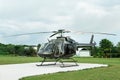 Beautiful modern helicopter on helipad in field Royalty Free Stock Photo