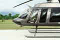Beautiful modern helicopter on helipad in field Royalty Free Stock Photo