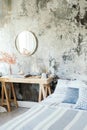 Beautiful and modern interior design of the hotel and bedroom. A grime mirror in a bedroom. loft wall. Boho style Royalty Free Stock Photo