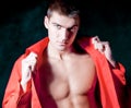 Beautiful modern macho man in red shirt is posing Royalty Free Stock Photo