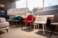 Beautiful modern retro style colorful chairs, on dispay for sale in the furniture store showroom with settees, couches and sofas