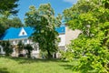 A beautiful modern sanatorium with a blue roof standing in a good place with picturesque nature