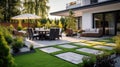 Beautiful of modern terrace with deck flooring and fence, green potted flowers plants and outdoors furniture. Cozy relaxing area