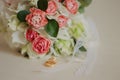 Beautiful modern wedding bouquet on a white table. Wedding attributes. No people