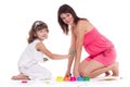 beautiful mommy and her kid paintig a picture for kindergardern. hobby, education, development , child developing