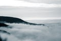 A beautiful monochromatic mountain view with rising clouds Royalty Free Stock Photo