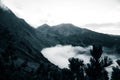 A beautiful monochromatic mountain view with rising clouds Royalty Free Stock Photo