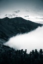 A beautiful monochromatic mountain view with rising clouds Royalty Free Stock Photo