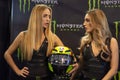 Beautiful Monster Energy girls pose with the motorcycle at Belgrade Car and Motor Show Royalty Free Stock Photo