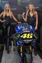 Beautiful Monster Energy girls pose with the motorcycle at Belgrade Car and Motor Show Royalty Free Stock Photo