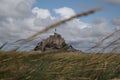 Beautiful Mont Saint Michel cathedral on the island, Normandy, Northern France, Europe. with livestock of sheeps. View at the Mont Royalty Free Stock Photo