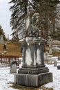 Beautiful monument of angel and other gravestones in Winter snow, Greenridge Cemetery,Saratoga Springs,NY,2016 Royalty Free Stock Photo