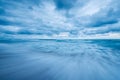 A beautiful moody blue seascape taken on an overcast day with dramatic stormy clouds