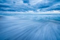 A beautiful moody blue seascape taken on an overcast day with dramatic stormy clouds