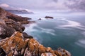 A beautiful moody golden seascape taken on a stormy cloudy evening after sunset Royalty Free Stock Photo