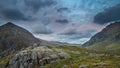 Beautiful dramatic landscape image of Nant Francon valley in Snowdonia during sunset in Autumn