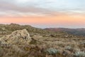 Beautiful and moody low angle evening view of the mountain landscape & grass near the summit of Mount Kosciuszko