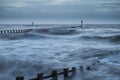 Beautiful dramatic stormy landscape image of waves crashing onto Royalty Free Stock Photo