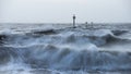 Beautiful dramatic stormy landscape image of waves crashing onto