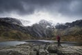 Beautiful moody Winter landscape image of Llyn Idwal and snowcapped Glyders Mountain Range in Snowdonia