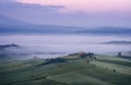 Beautiful morning landscape with fog in Tuscany, Italy