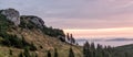 Beautiful morning landscape in the mountains with trees, rocks and fog, panorama