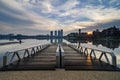 Beautiful morning near the lakeside, modern building and wooden jetty Royalty Free Stock Photo